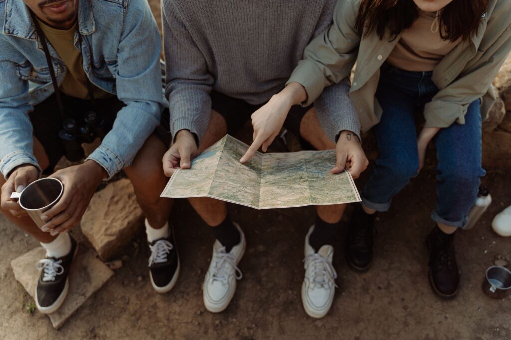 Friends planning a budget-friendly group trip together